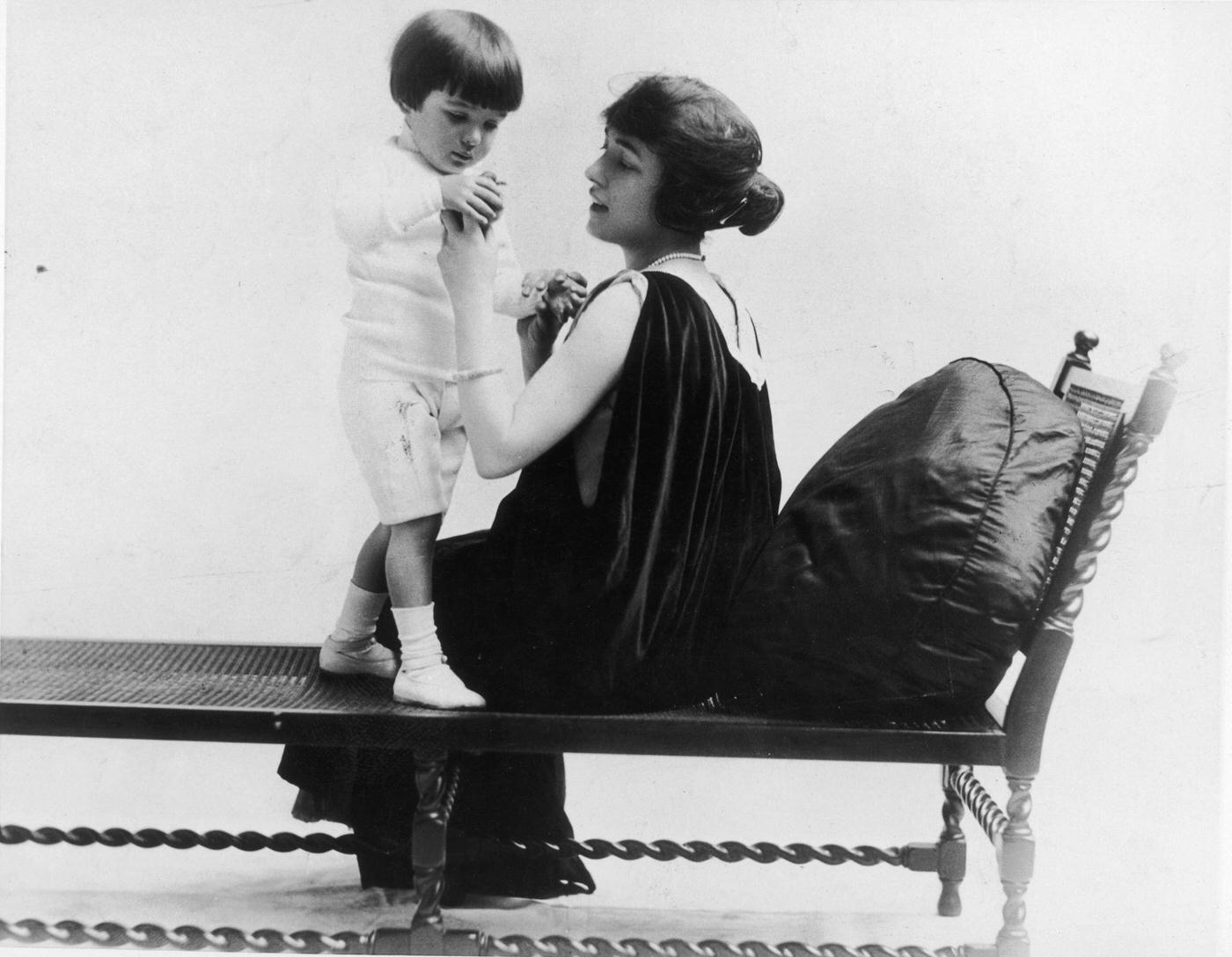 Evelyn Nesbit Playing With Her Son Russell On A Lounge Chair, 1903.