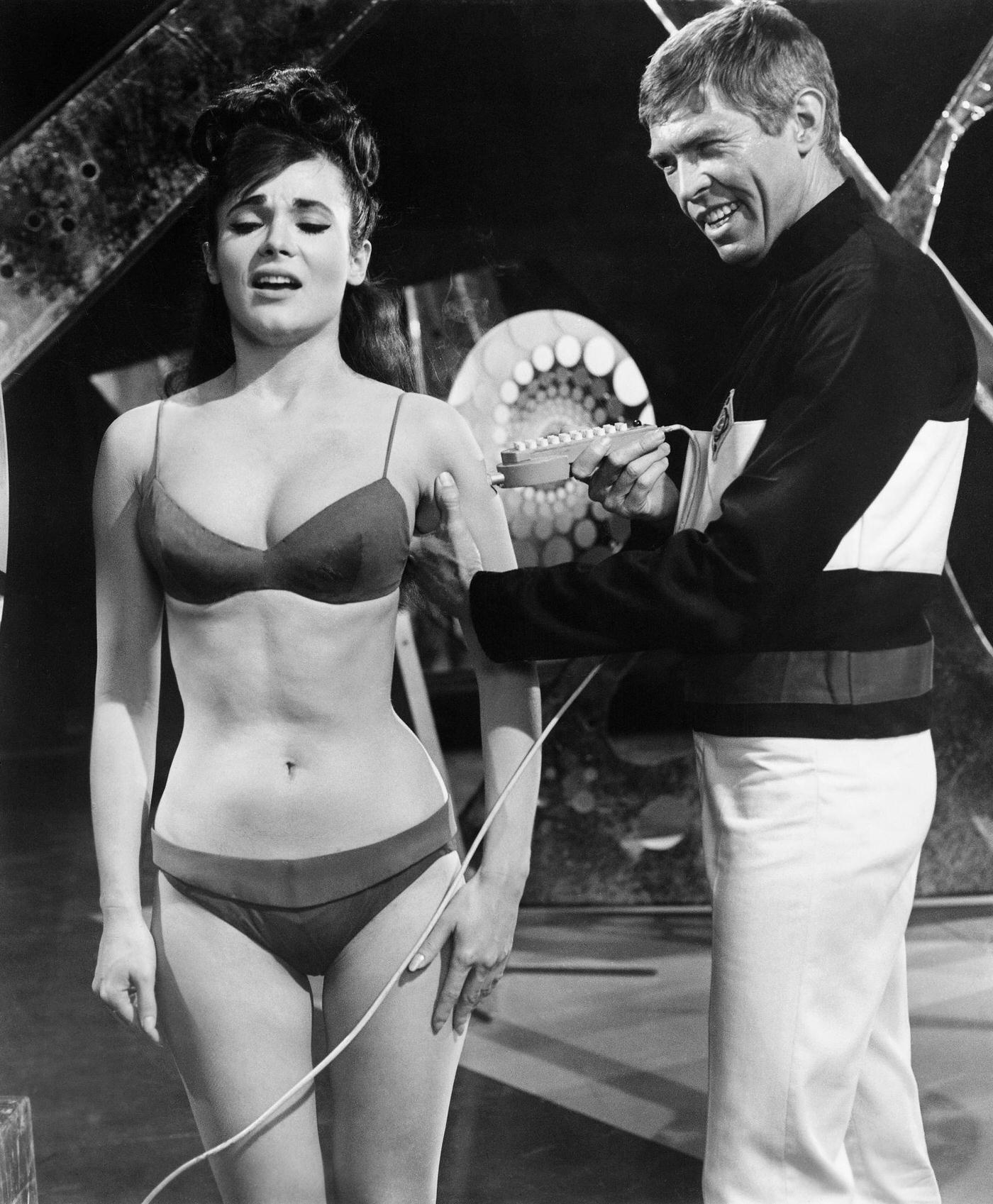 James Coburn And Gila Golan In A Scene From The 1966 Film Our Man Flint, A James Bond Spoof About A Spy Who Takes On Villains That Want To Take Over The World With An Earthquake Machine.