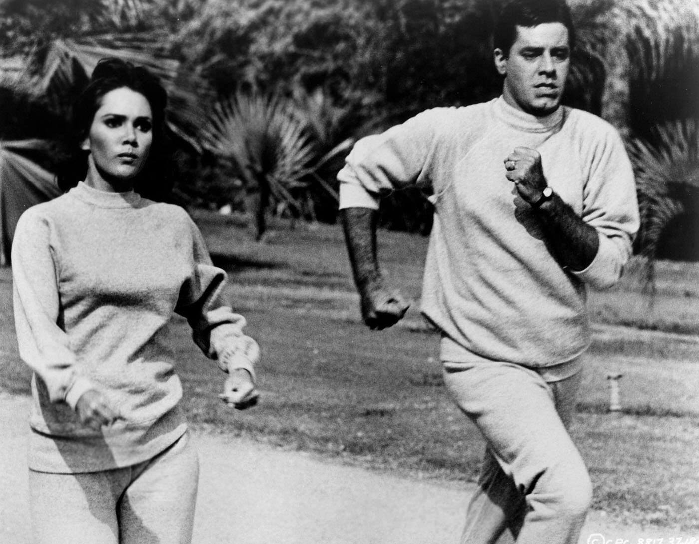 Gila Golan Running With Jerry Lewis In A Scene From The Movie Three On A Couch, 1966.