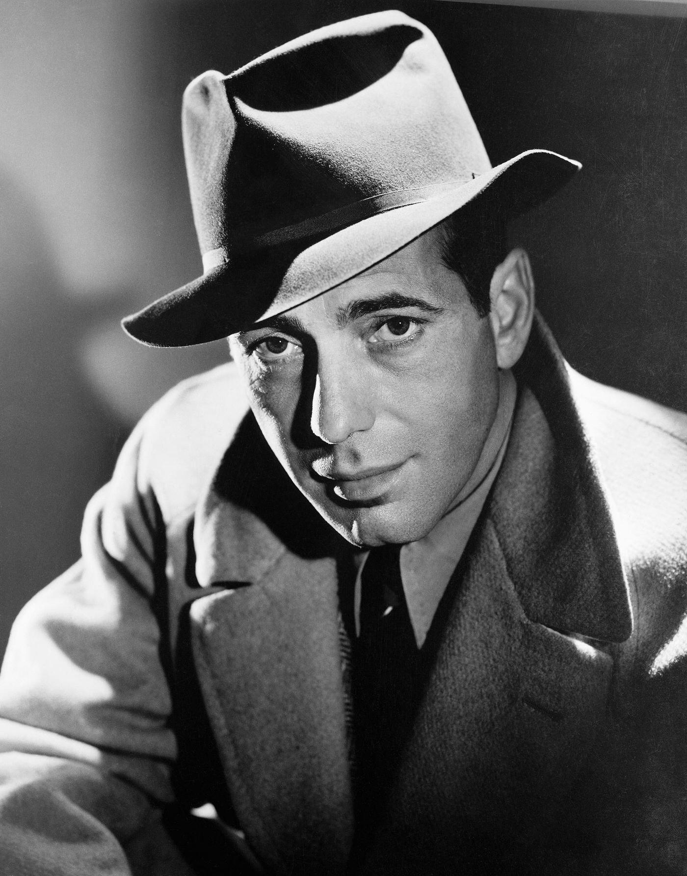 Humphrey Bogart In A Fedora Hat And Overcoat