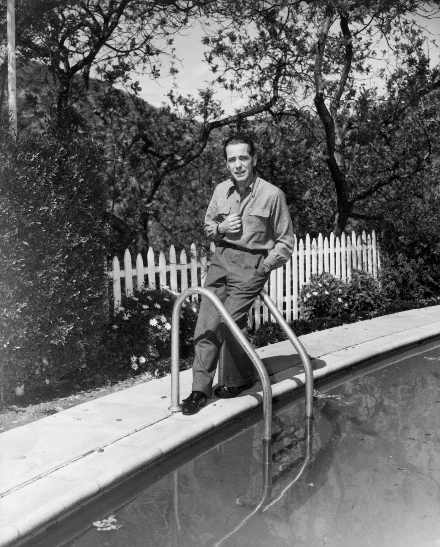 Humphrey Bogart Posing On The Grounds Of His Beverly Hills Home, Star Of Warner Bros. Chain Lightening