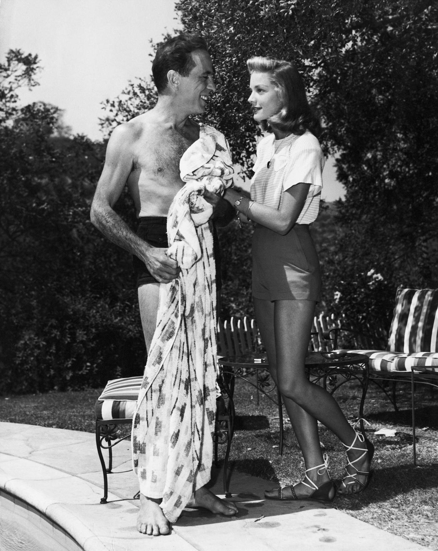 Humphrey Bogart And Lauren Bacall In The Garden Of Their Home