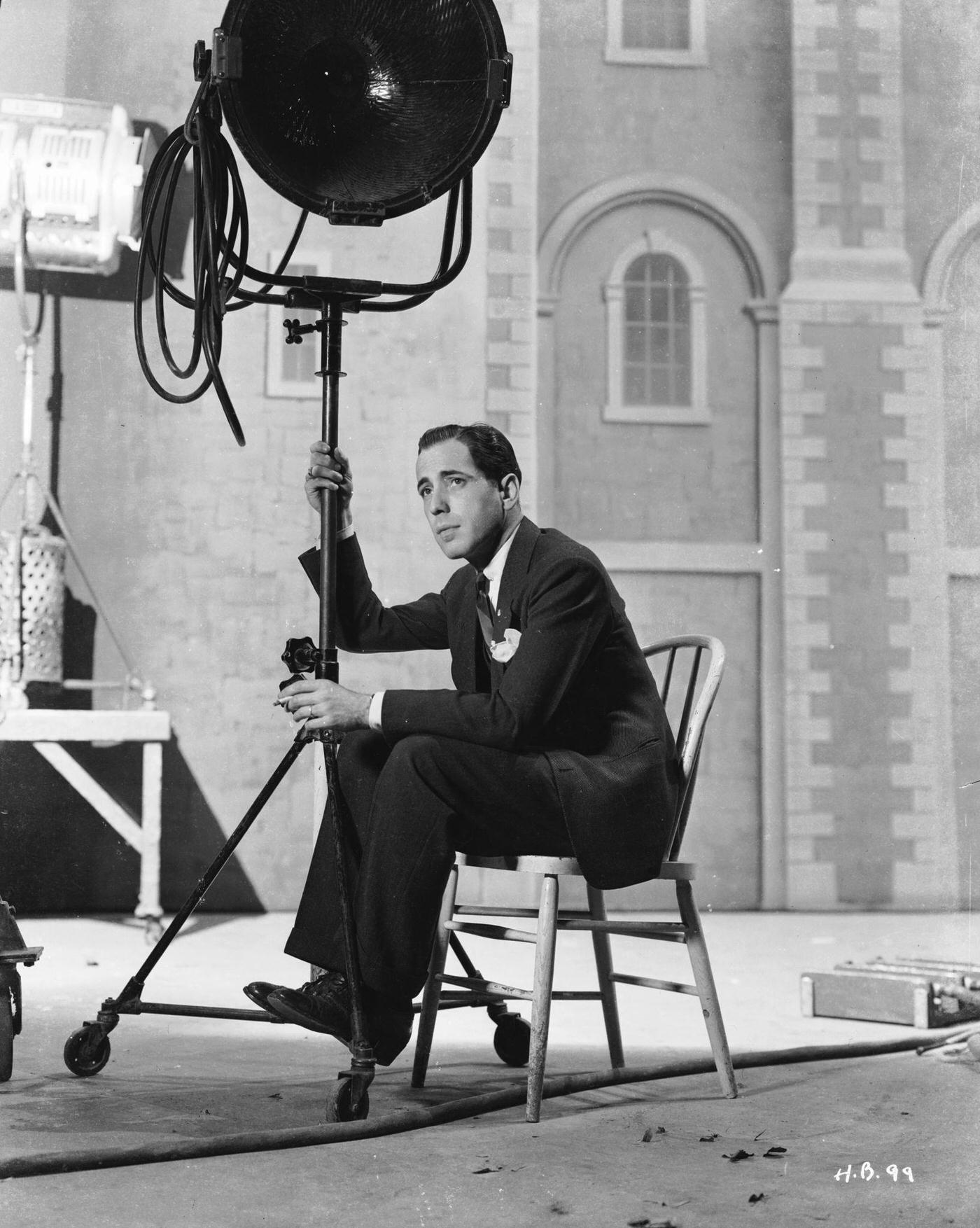 Humphrey Bogart Sitting Under A Film Studio Light, 1940