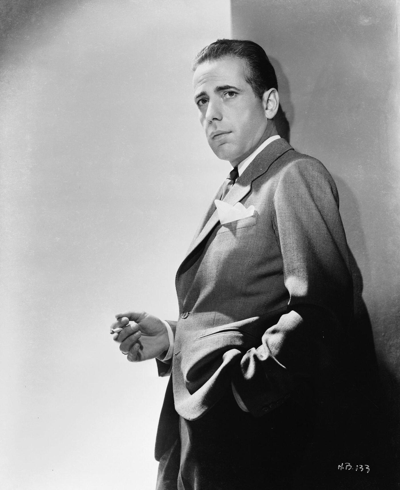 Humphrey Bogart Leaning Against A Wall Smoking A Cigarette, 1940
