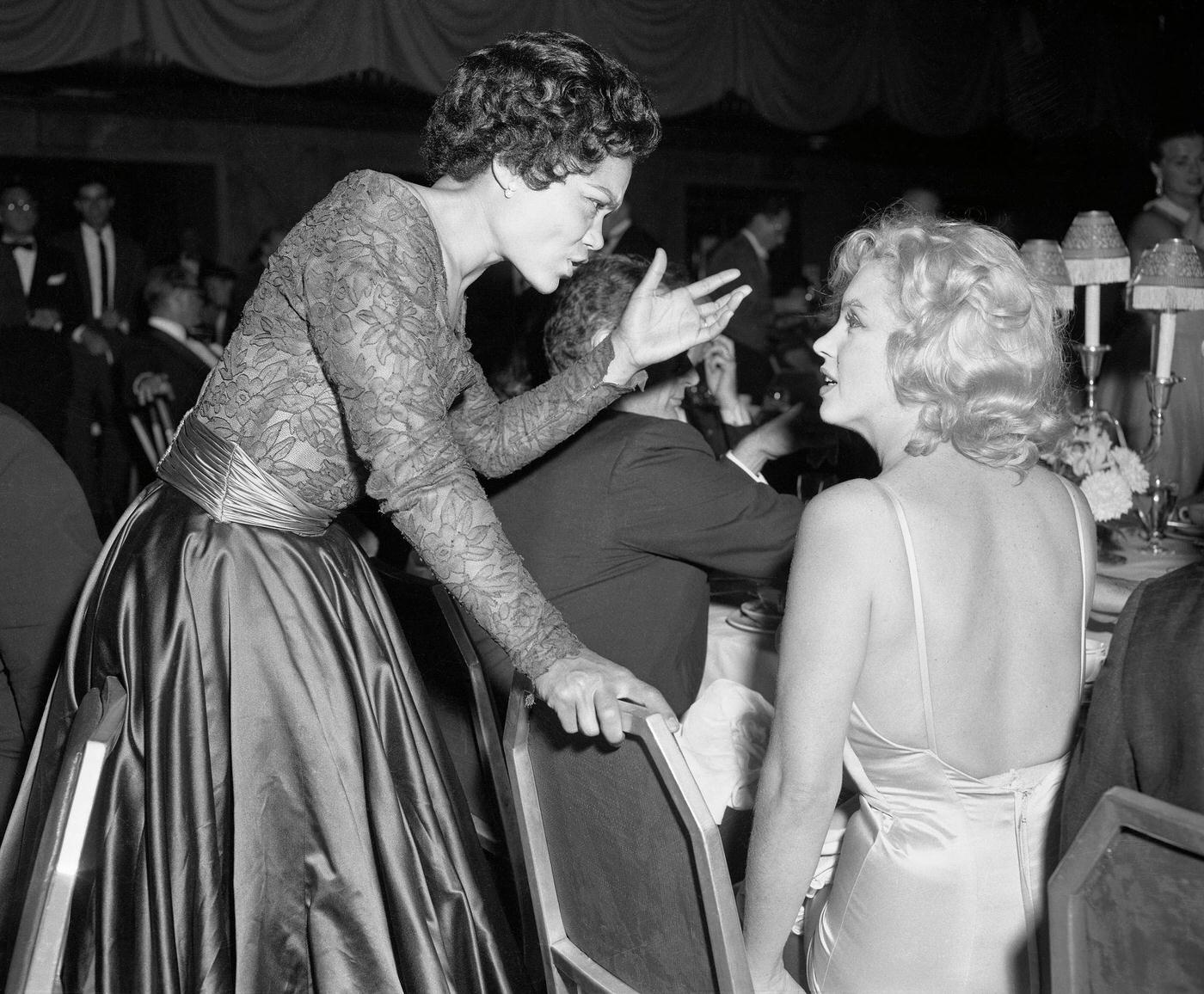 Eartha Kitt Chatting With Marilyn Monroe At The Milk Fund Dinner