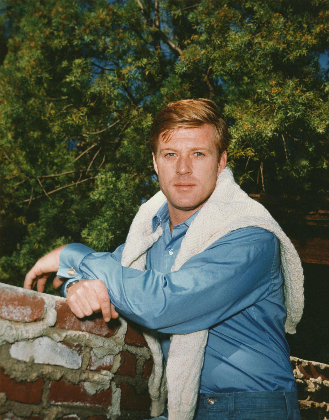 Robert Redford Leaning On A Brick Wall.