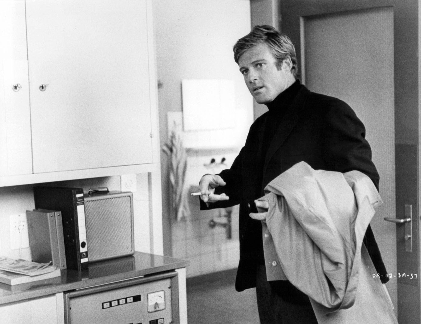 Robert Redford Holding A Coat And Cigarette In A Scene From 'The Downhill Racer', 1969.