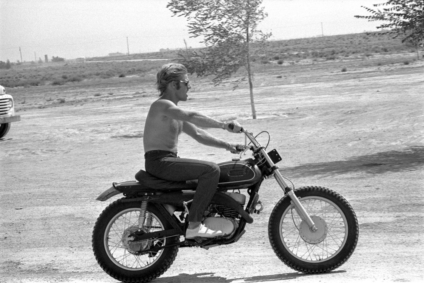 Robert Redford Riding A Motocross Motorcycle On A Dirt Road, 1969.