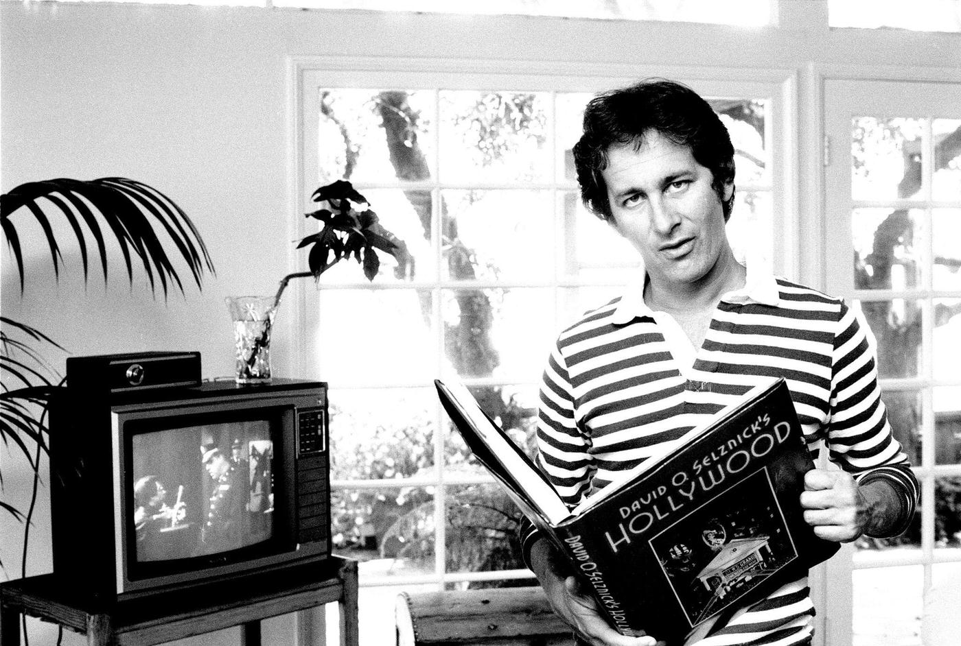 Steven Spielberg Posing At Home While Reading A Book, 'Hollywood' By David O Selznick, In Los Angeles, California, 1981.