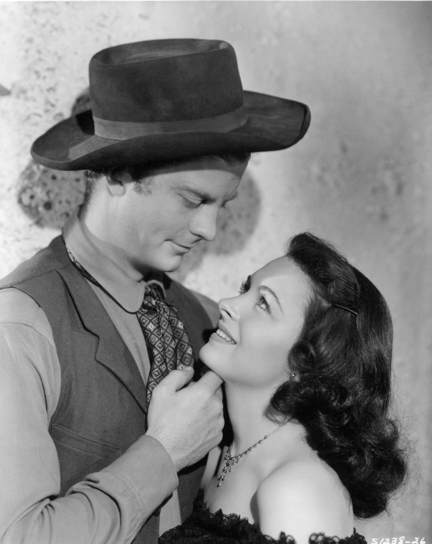 William Lundigan Looks Into Donna Reed'S Eyes In A Scene From The 1942 Film &Amp;Quot;Apache Trail.&Amp;Quot;