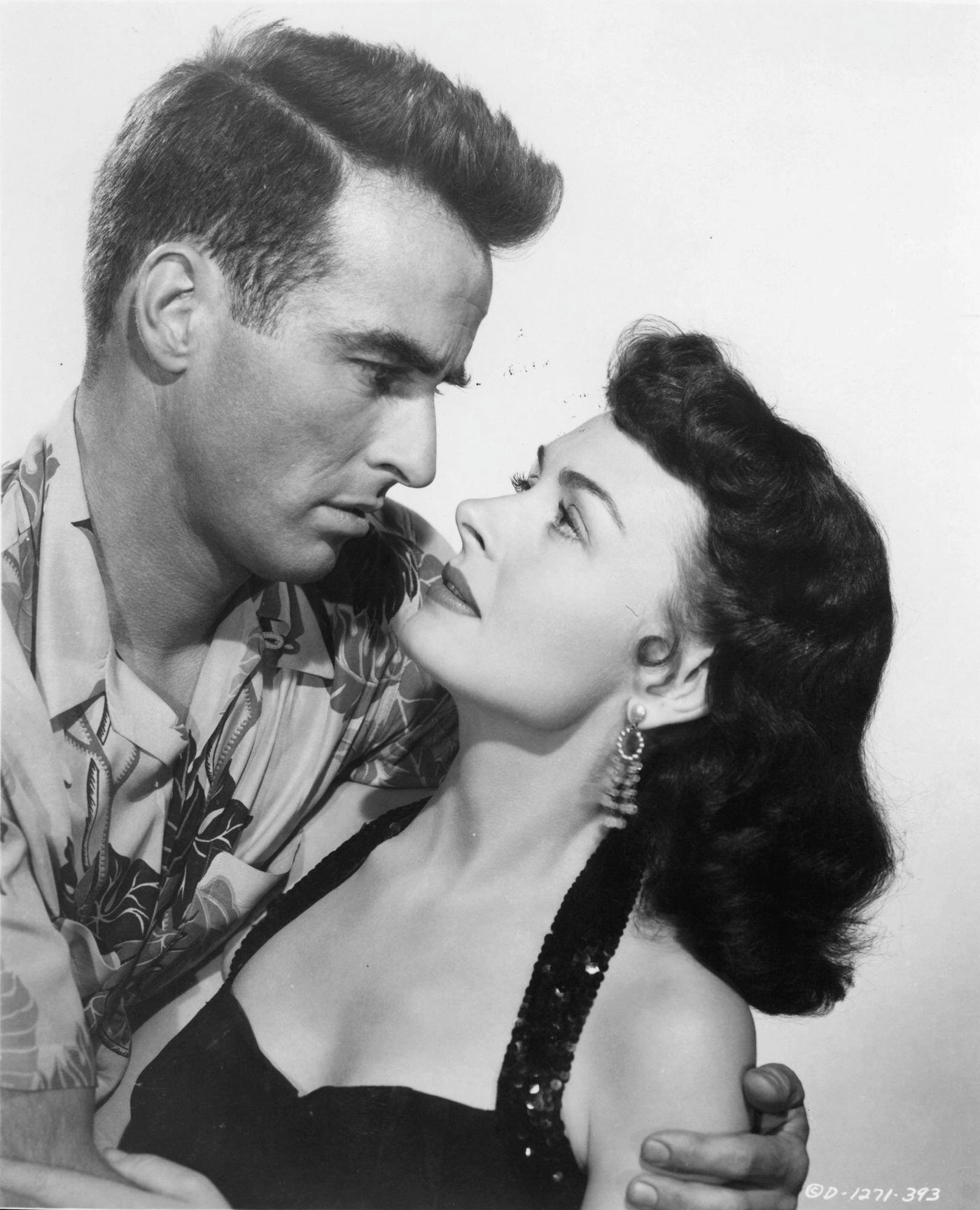 Donna Reed Holds A Brush To Her Eyelashes In A 1953 Portrait.