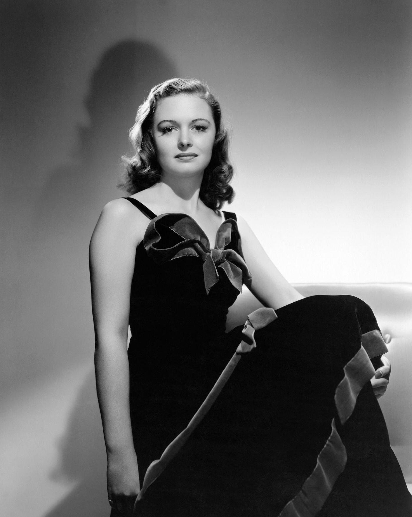 Actress Donna Reed, Former Campus Queen, Posed In A Dark Dress With A Velvet Bow On The Chest For Her First Portrait Sitting In 1941, Wearing Her Signature Smile.