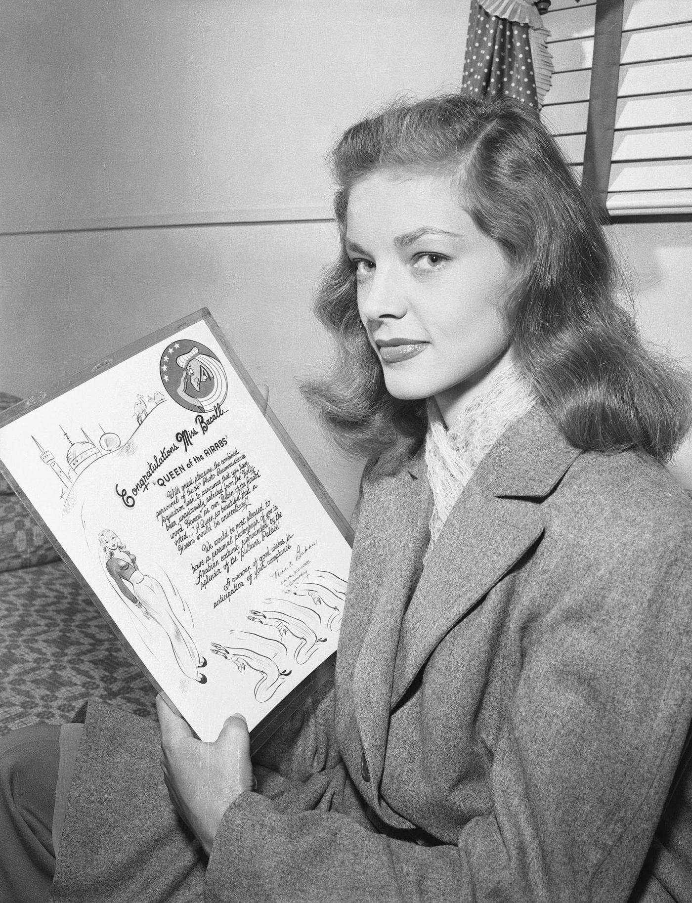 Streamlined Lauren Bacall Holding A Plaque In Honor Of Her Good Looks, In Her Screen Debut As Humphrey Bogart'S Love Interest In &Amp;Quot;To Have And To Have Not&Amp;Quot; (1944