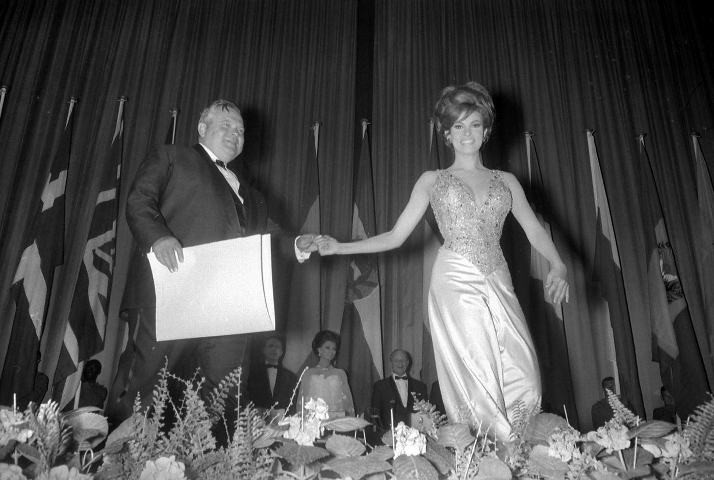 Raquel Welch Presenting Orson Welles With A Special Prize At The Cannes Film Festival, 1966.