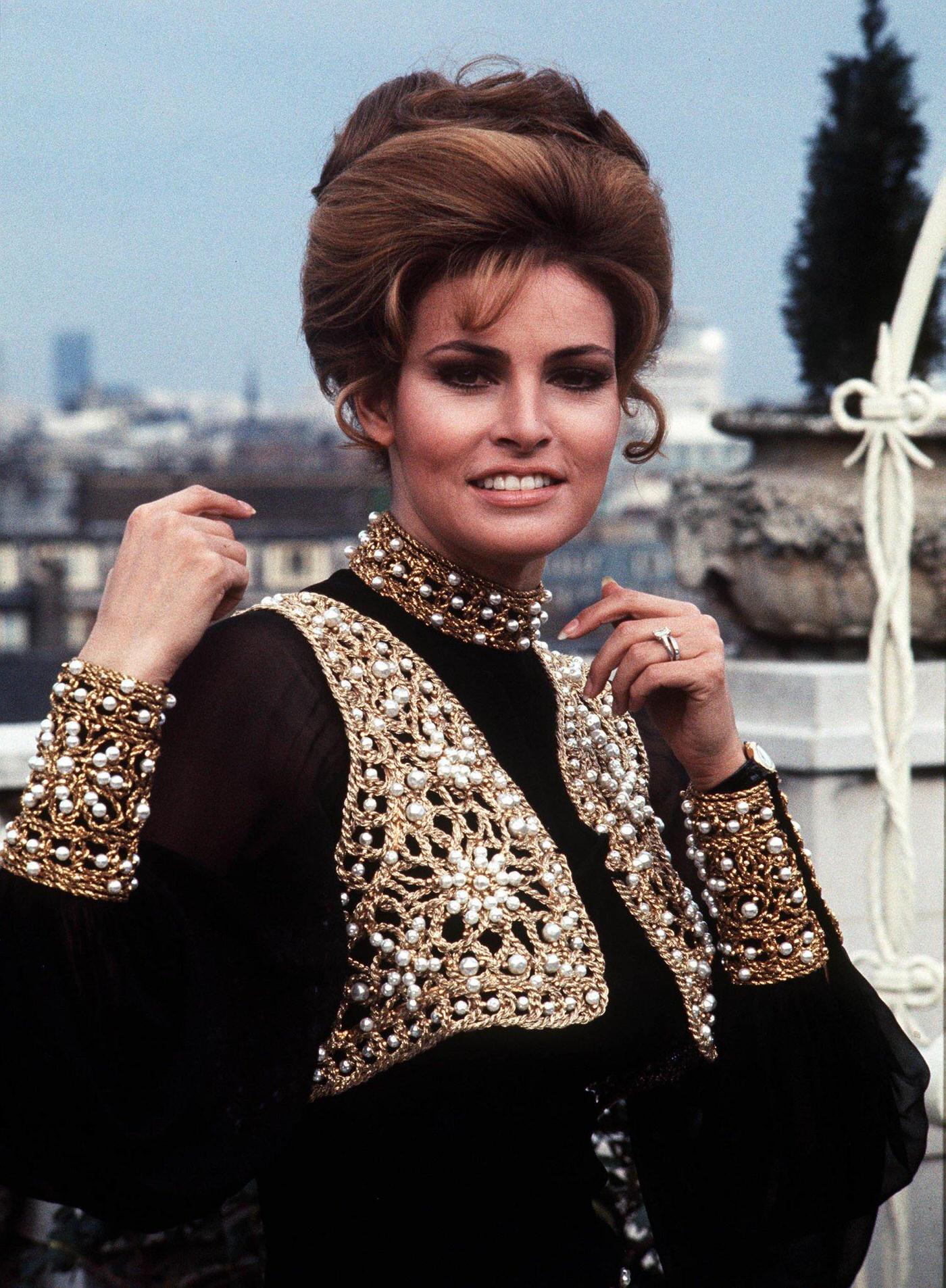Raquel Welch Poses On The Roof Of London'S Dorchester Hotel In A Richly Decorated Trouser Suit, 1969.