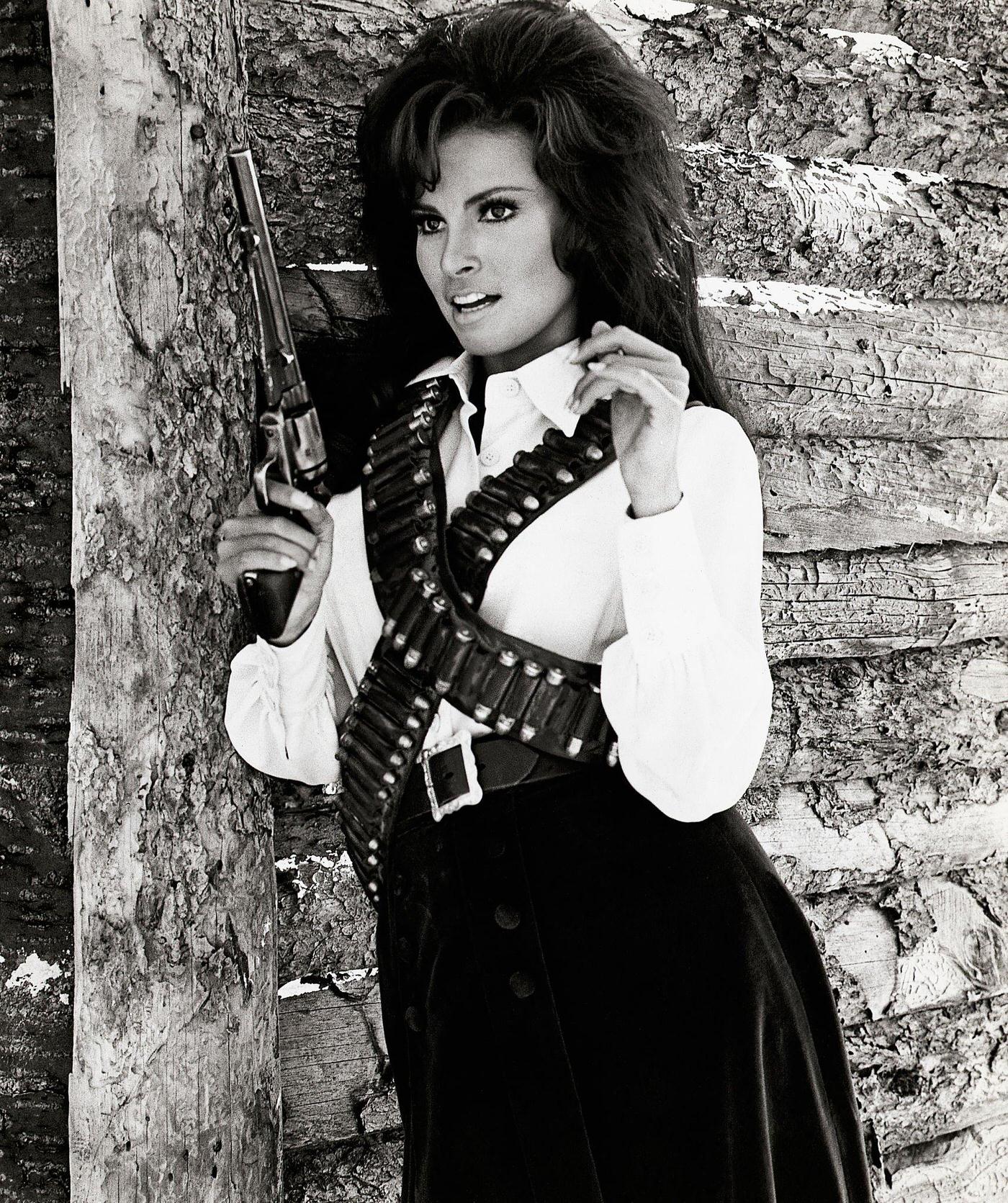 Raquel Welch In A Cowboy Outfit, Holding A Large Gun, From The Movie 'Bandolero!' Released In 1968.
