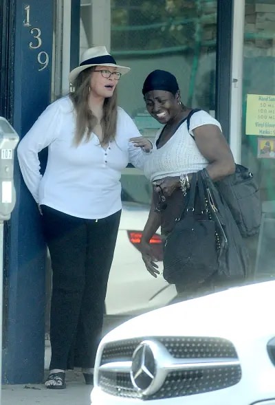 The Woman Accompanying Welch Was Seen Carrying Several Bags As They Engaged In Conversation.