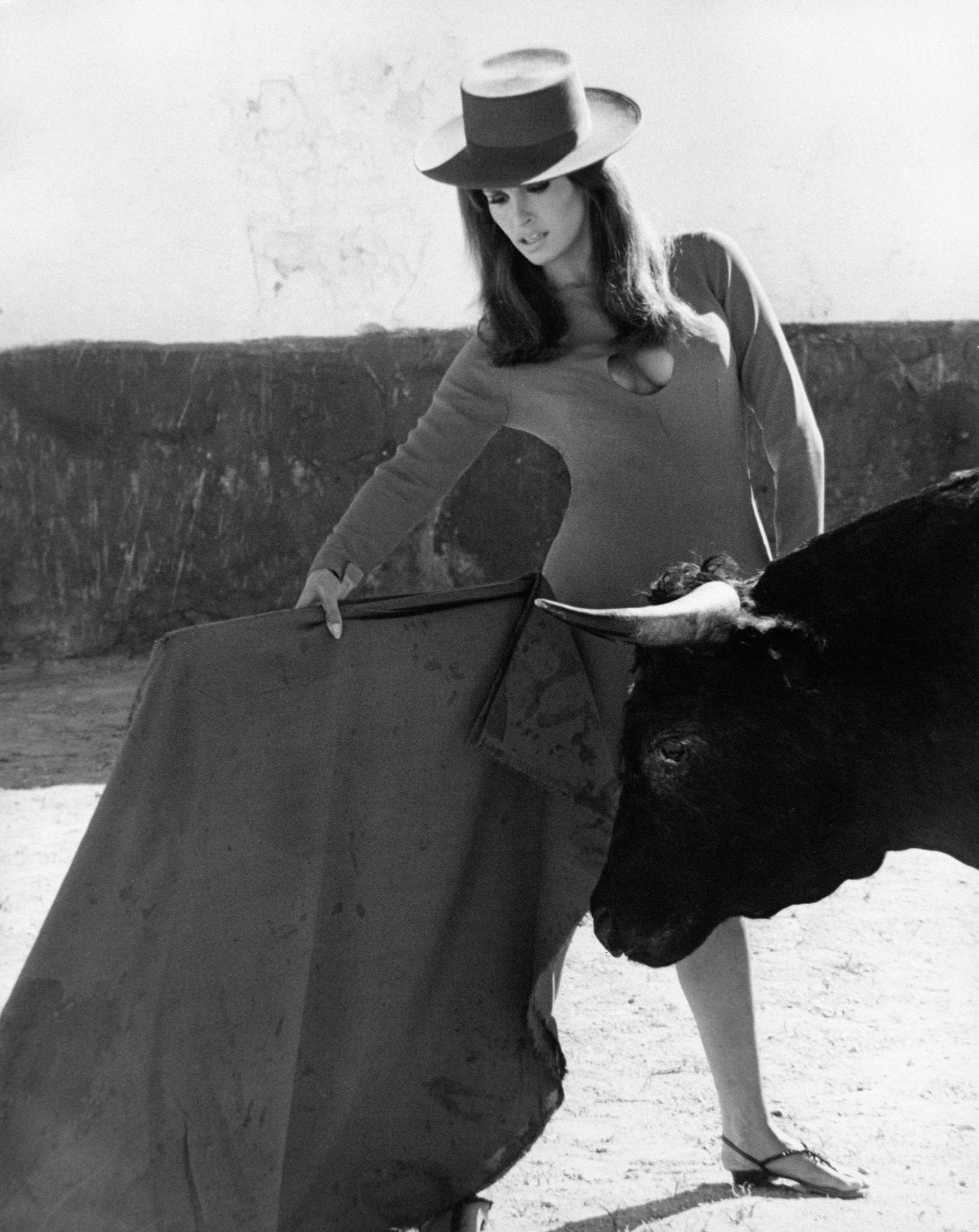 Raquel Welch Holding A Cape, Pretending To Be A Bullfighter In Malaga, 1966.