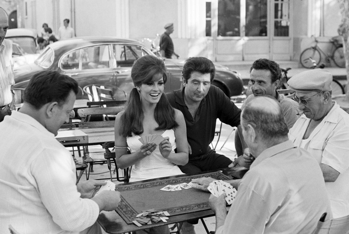 Raquel Welch Playing Cards With Locals In Saint-Tropez, July 1966.