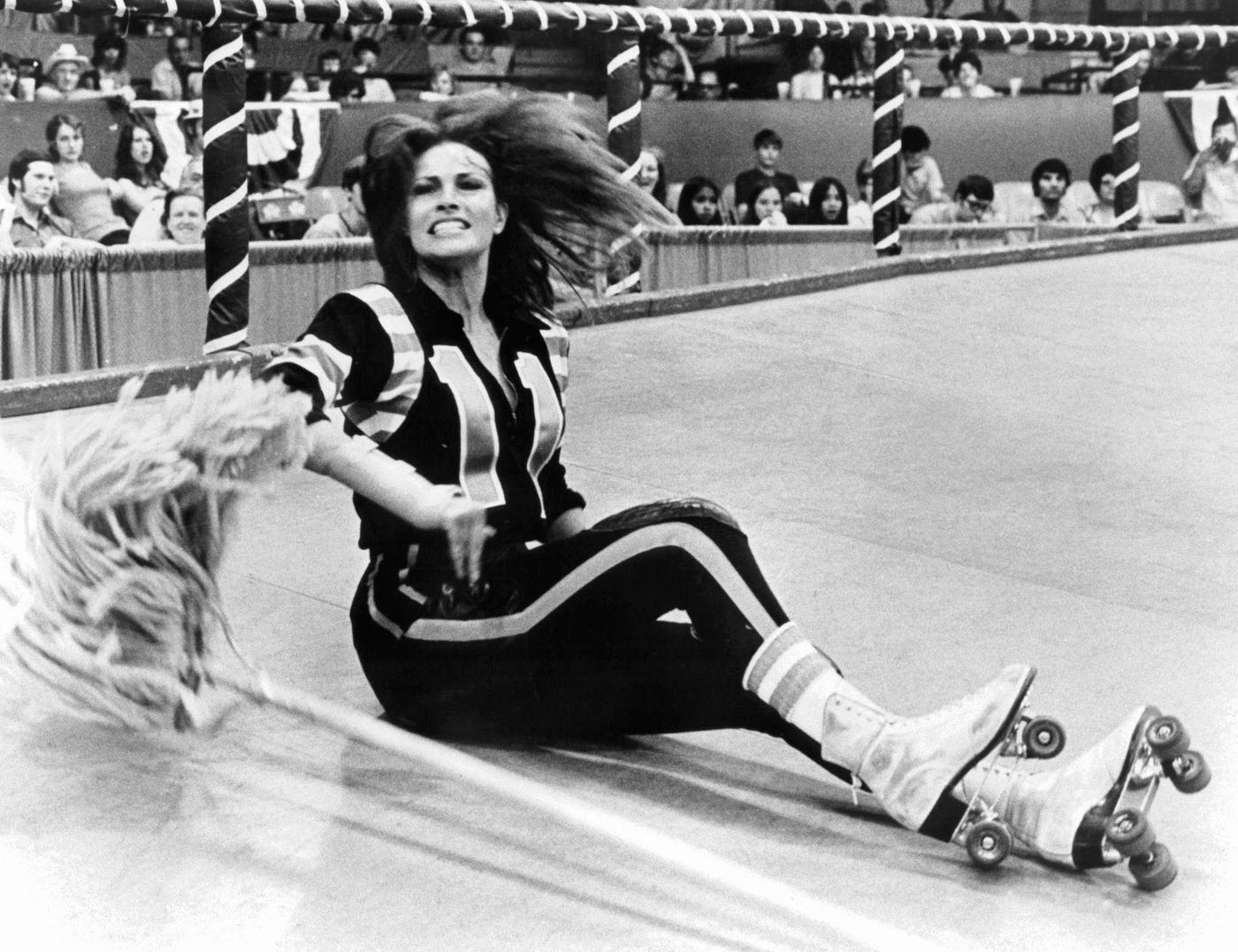 Raquel Welch Taking A Fall On The Rink In A Scene From The Film &Amp;Quot;Kansas City Bomber,&Amp;Quot; 1972.