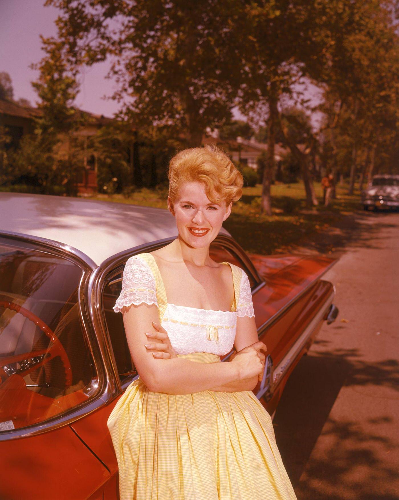 Connie Stevens Leans Against A Red Car, 1960