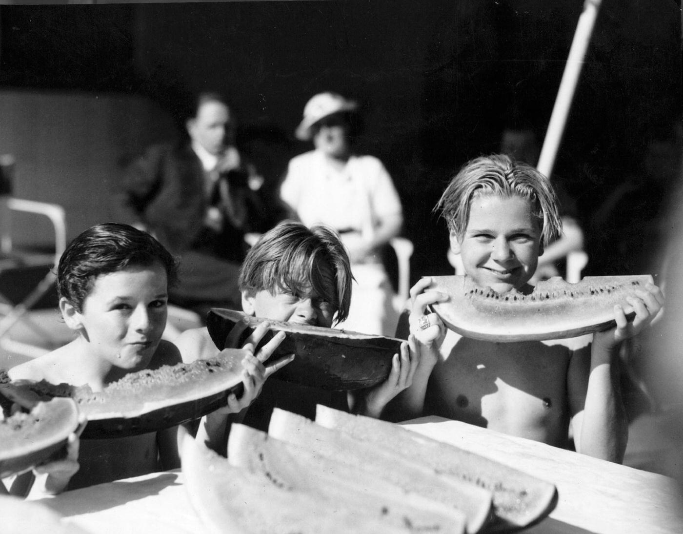 Mickey Rooney, Freddie Bartholomew, And Jackie Cooper Enjoying Melon In Hollywood, 1930.