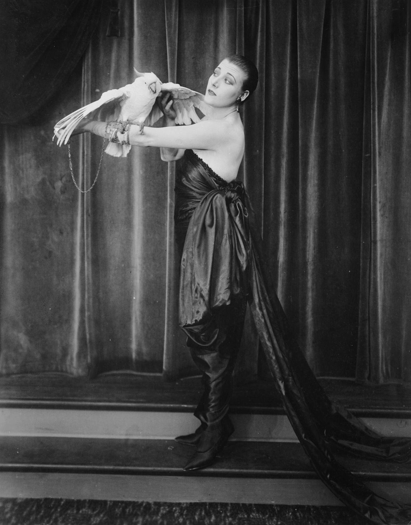 Gloria Swanson Poses With A White Cockatoo, Circa 1930.