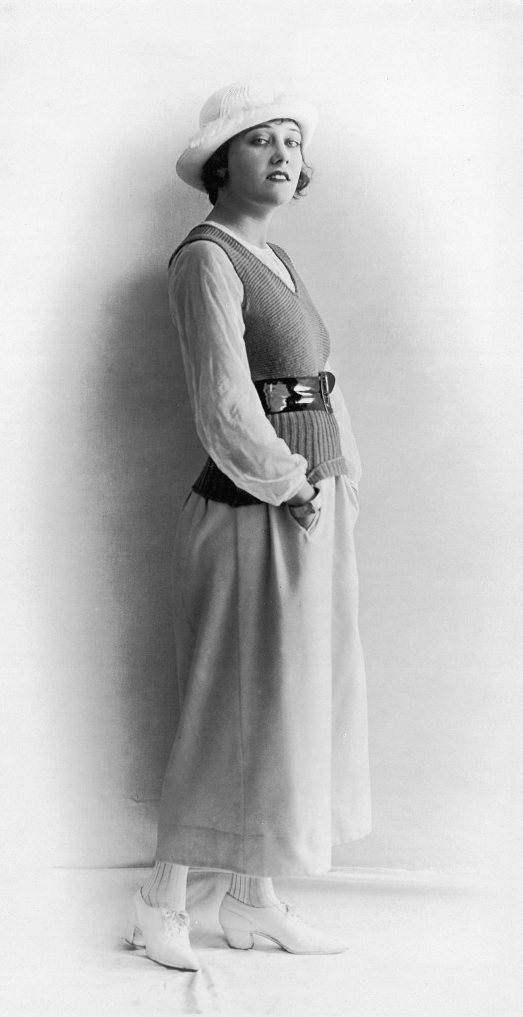 American Actor Gloria Swanson Standing With Hands In Skirt Pockets, Circa 1918.