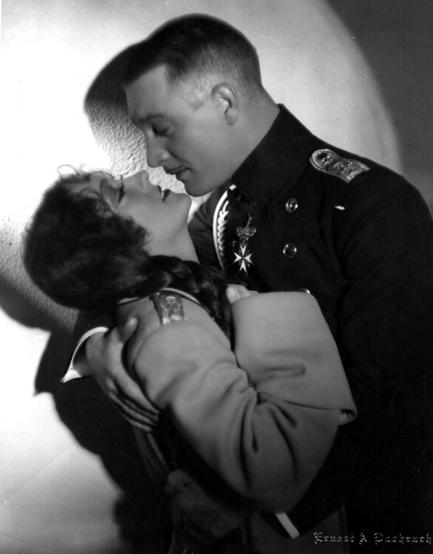 Gloria Swanson Swoons In The Arms Of Walter Byron (1899 - 1972) In 'Queen Kelly,' Directed By Erich Von Stroheim, 1929.