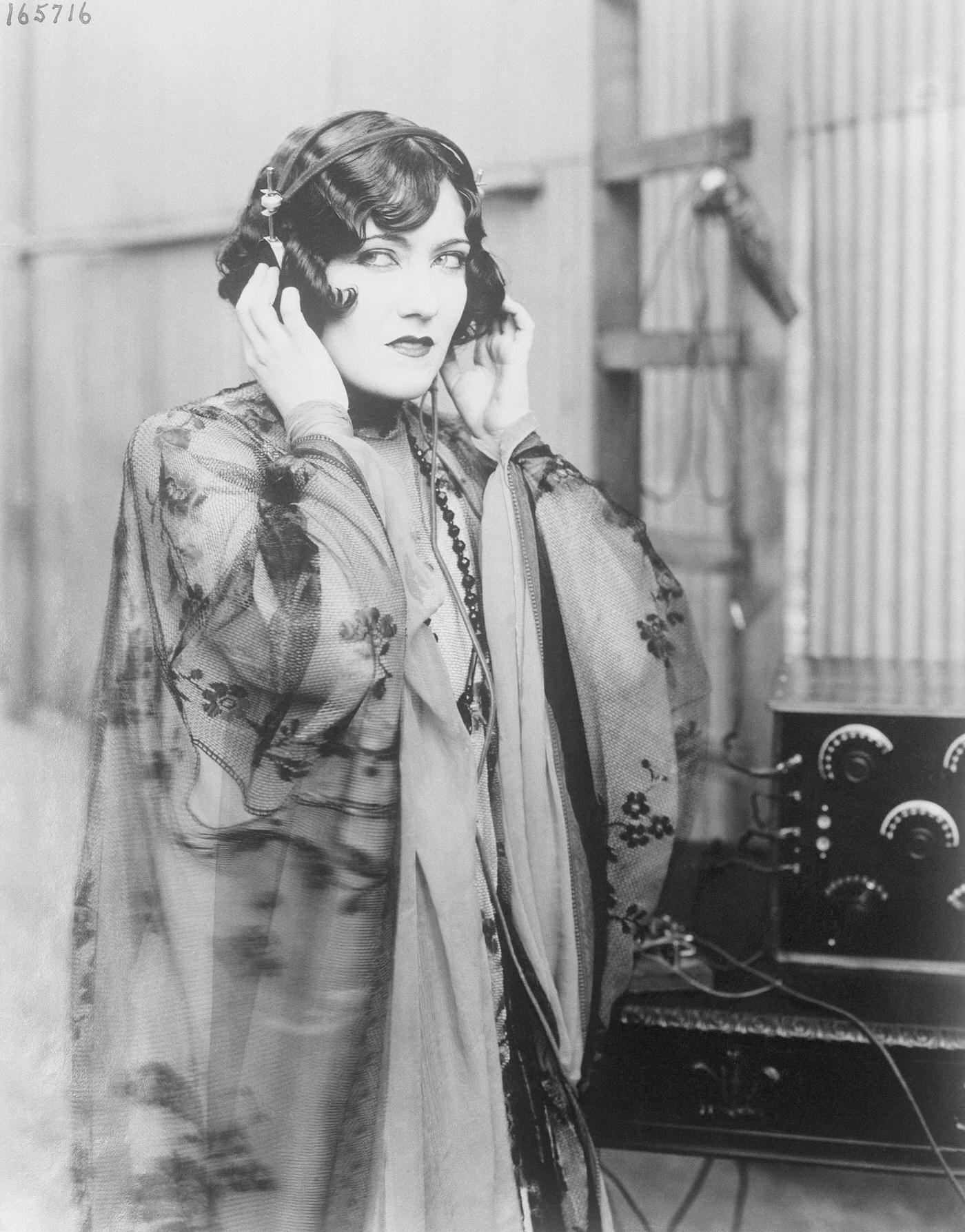 Gloria Swanson Listening To The Radio.