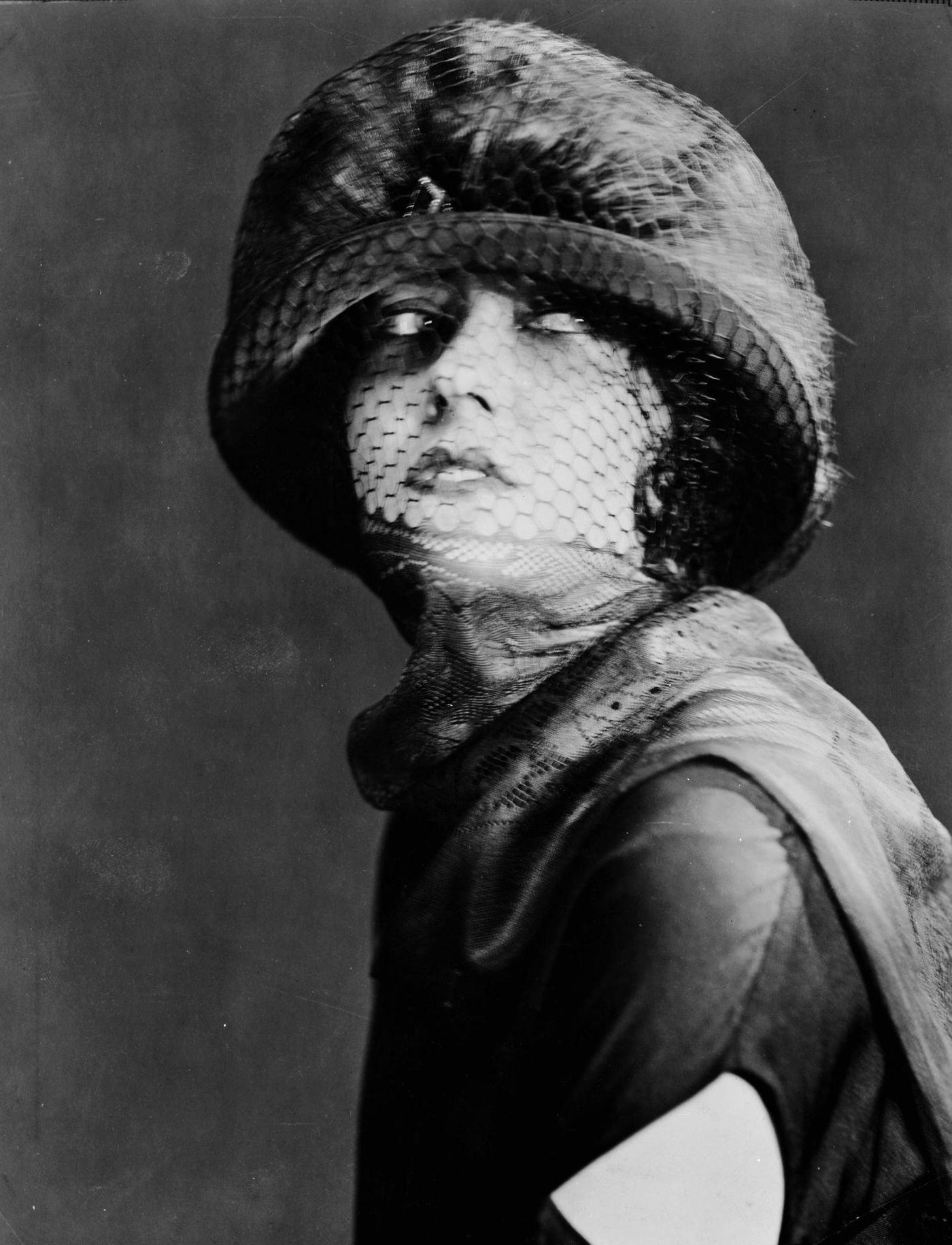Gloria Swanson Wearing A Hat With A Veil Covering Her Face, 1925.
