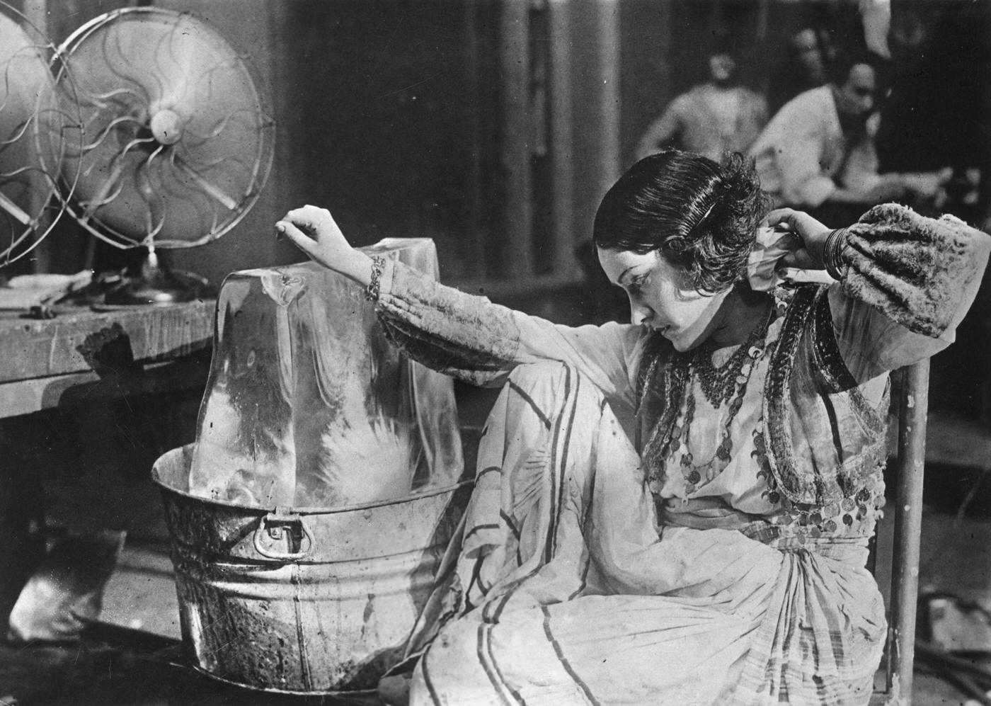 Gloria Swanson Cools Down On A Movie Set With Ice And Fans, 1925.