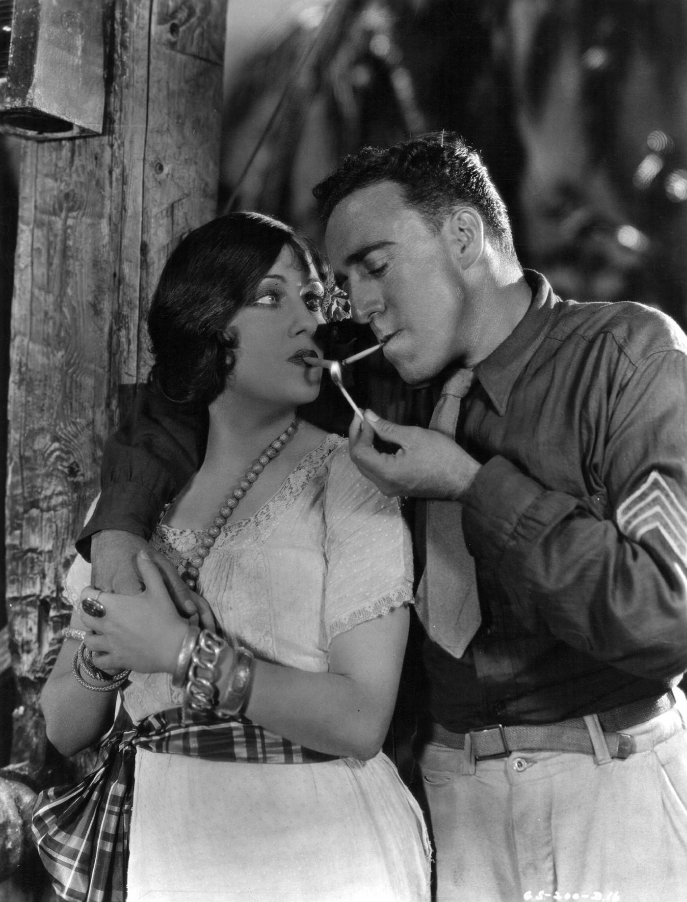 Gloria Swanson Shares A Match With A Us Marine In A Scene From 'Sadie Thompson,' 1927.