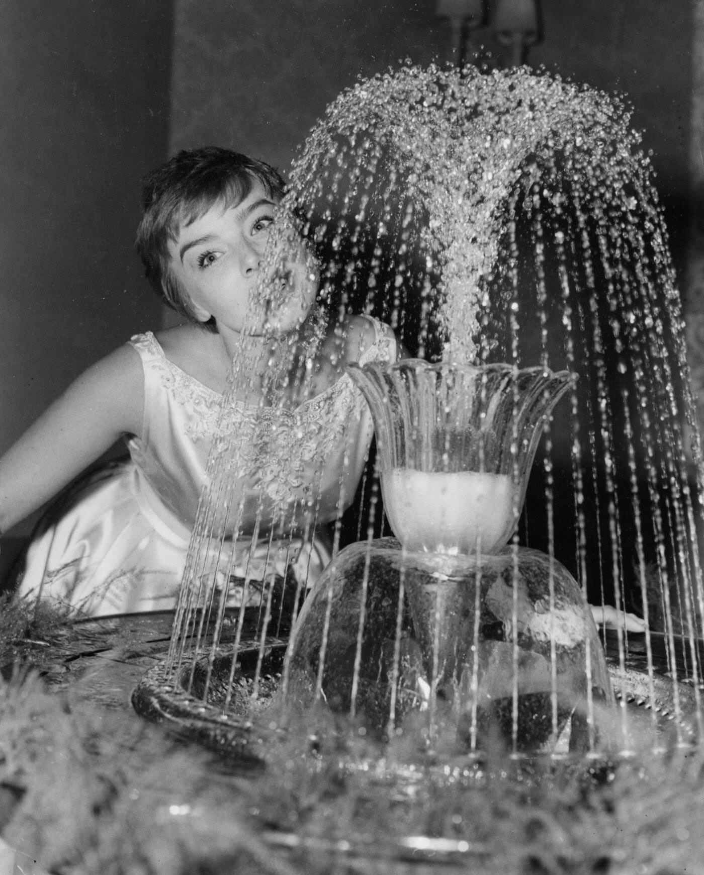 Portrait Of Actress Janet Munro Drinking From A Water Fountain At The Premiere Of &Amp;Quot;Sleeping Beauty,&Amp;Quot; London, July 1959.
