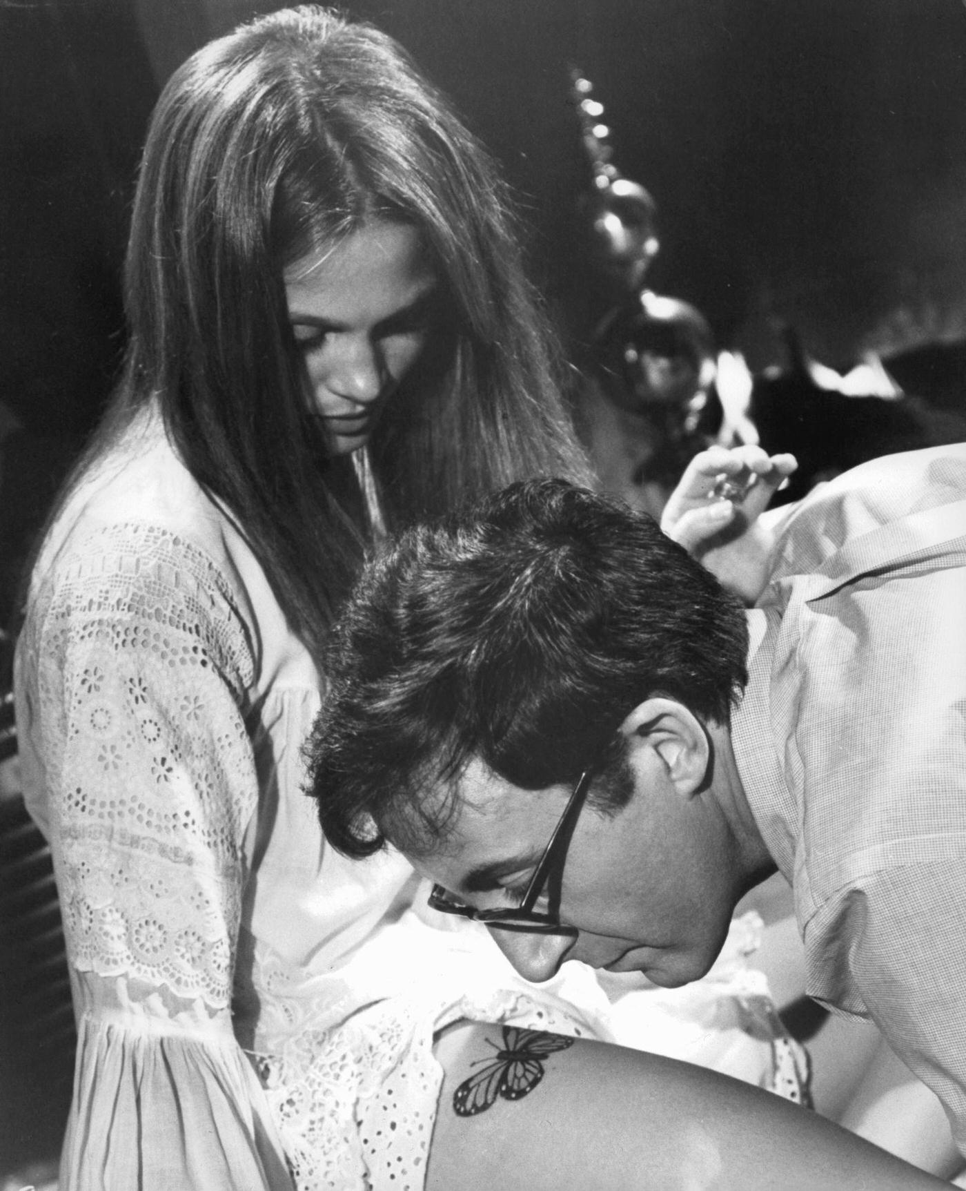 Leigh Taylor-Young Shows Tattoo To Peter Sellers In 'I Love You, Alice B. Toklas!,' 1968.