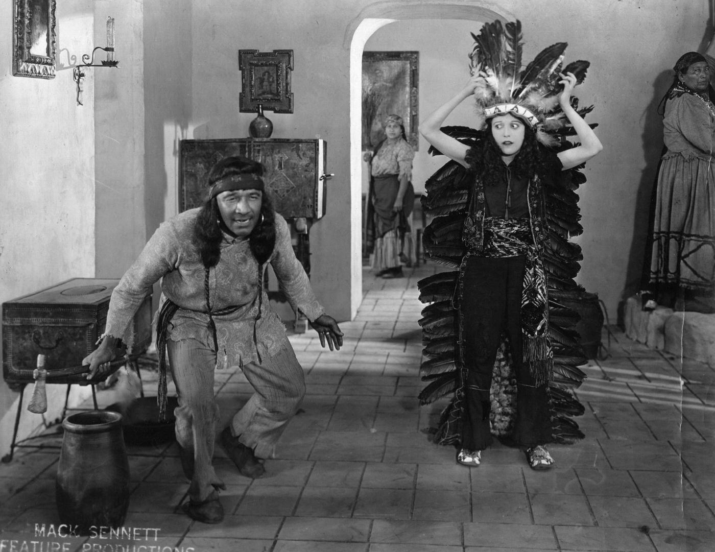 Mabel Normand Adjusts Her Headdress In A Scene From 'Suzanna,' 1923.