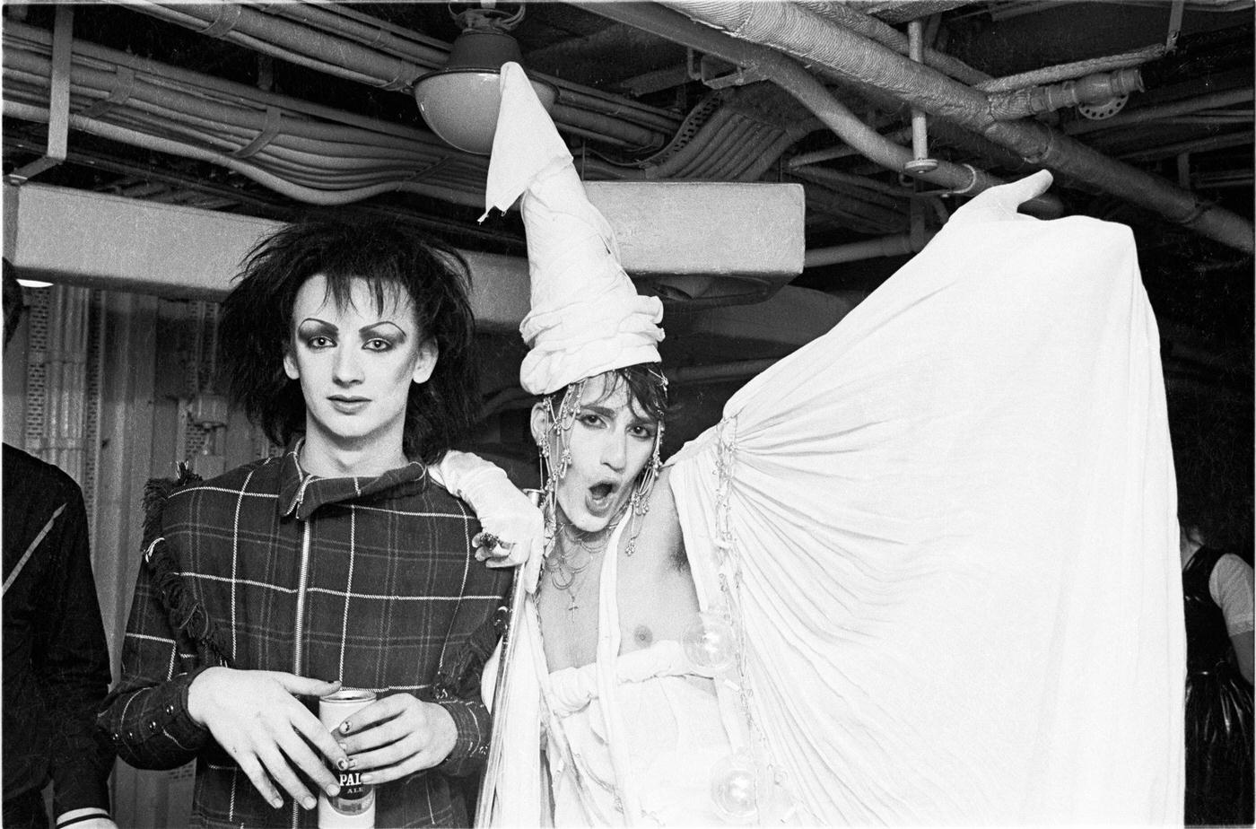 Boy George And A Friend With Fellow New Romantics Watch Spandau Ballet Perform Live On Hms Belfast, 1980.