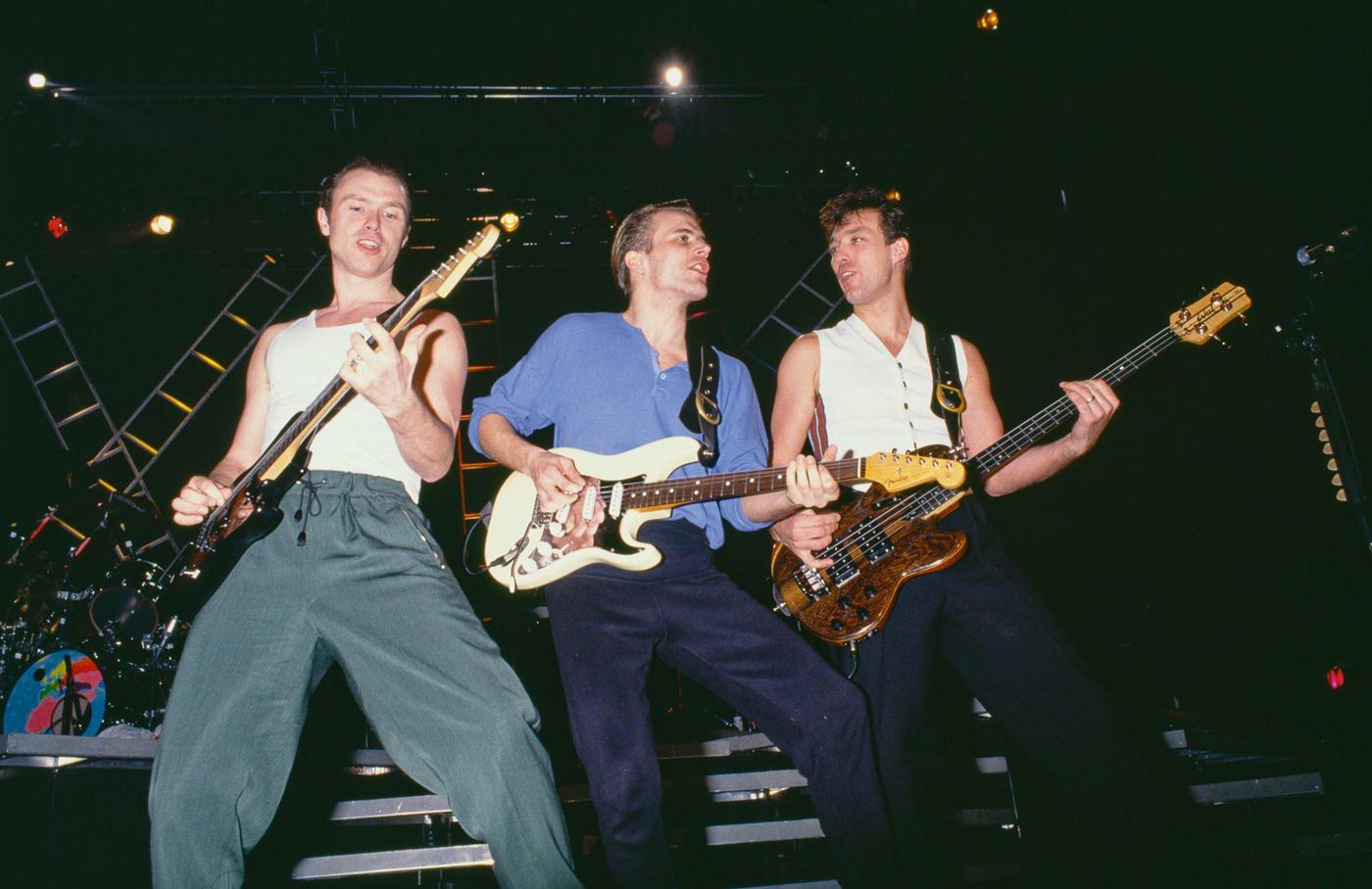 Gary Kemp, Steve Norman, And Martin Kemp Of British Pop Group Spandau Ballet Performing On Stage, 1985.