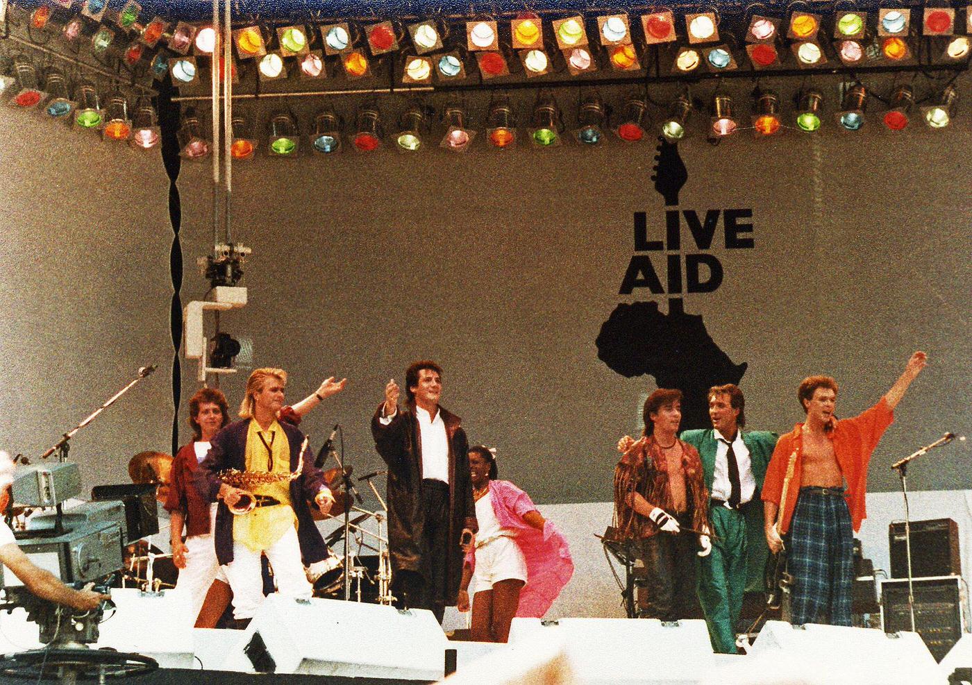 Members Of Spandau Ballet Wave Farewell To The Crowd After Performing At Live Aid, 1985.