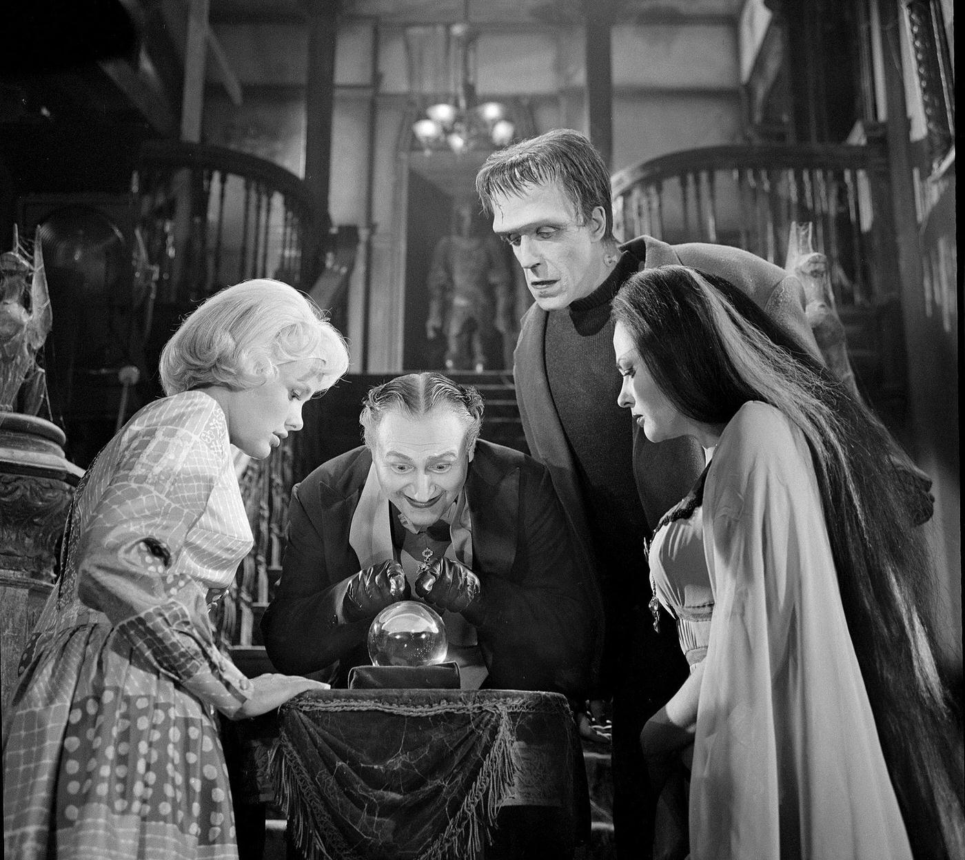 Cast Gazes Into A Crystal Ball In 'The Munsters,' 1964.