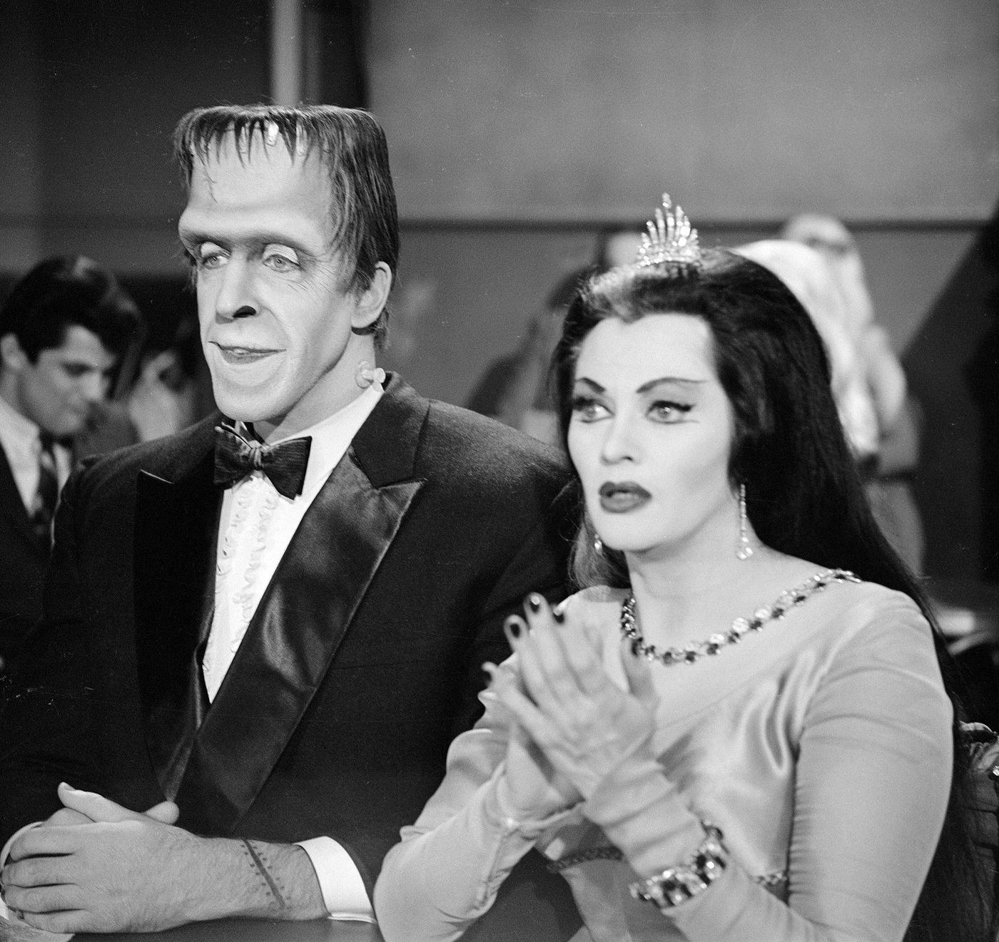 Fred Gwynne And Yvonne De Carlo Watch A Magic Act In 'The Munsters,' November 12, 1964.