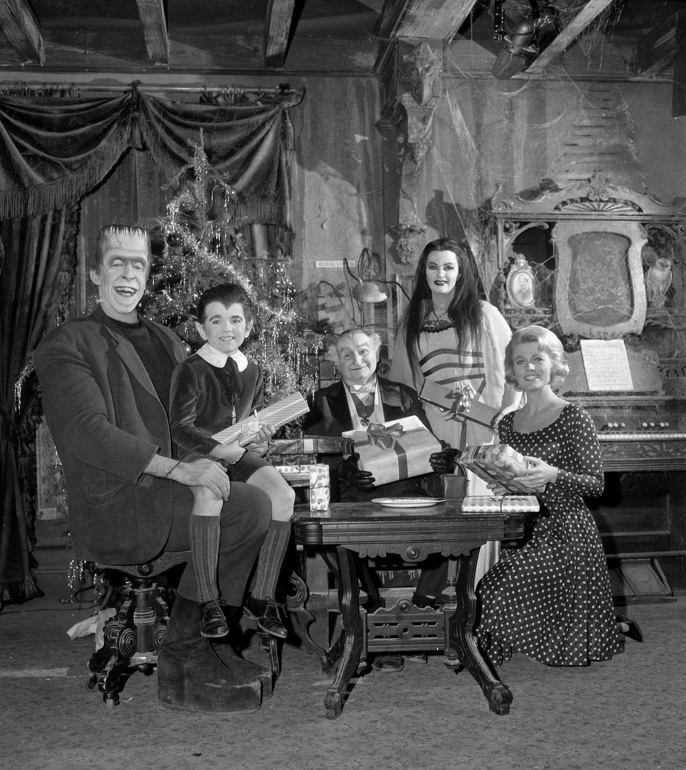Cast Holds Christmas Presents In A Cobwebbed Living Room For 'The Munsters' Episode 'Herman'S Rival,' December 3, 1964