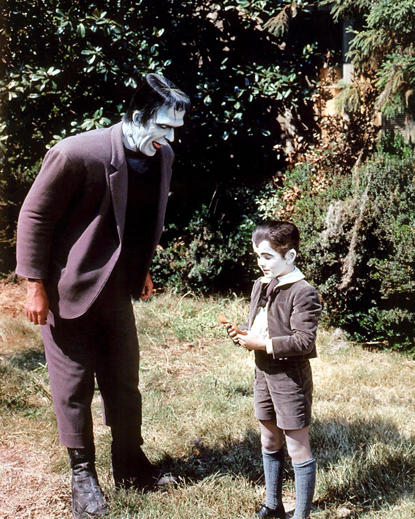 Fred Gwynne And Butch Patrick In 'The Munsters,' Circa 1965.