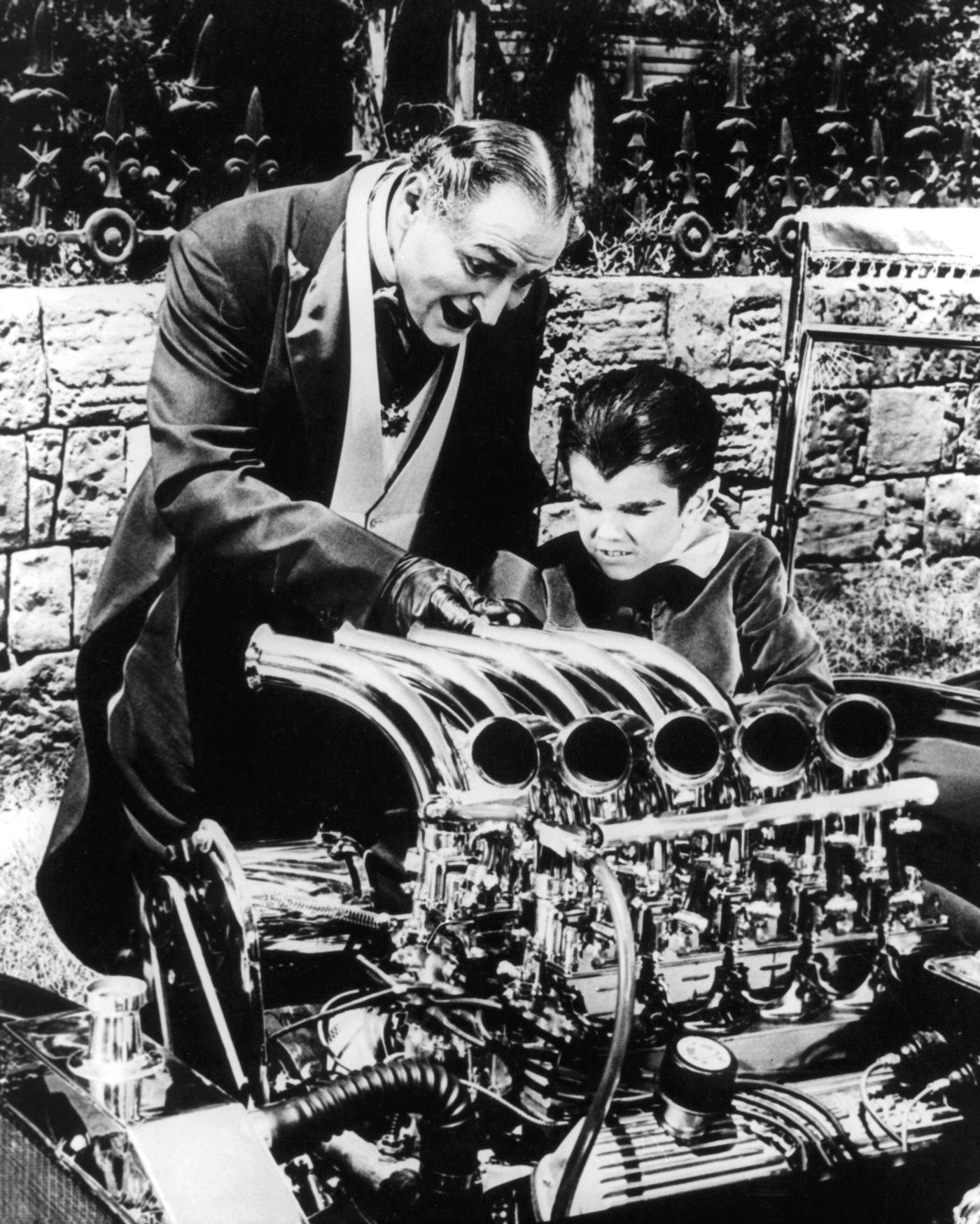 Al Lewis And Butch Patrick Work On An Engine In 'The Munsters,' 1964.