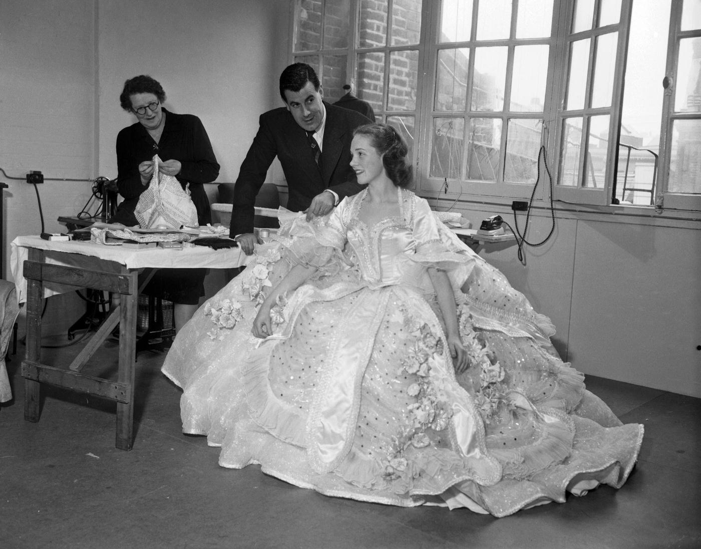 Julie Andrews Trying On A Dress For 'Cinderella', 1953.