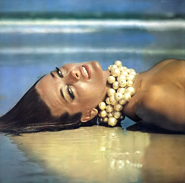 Dolores Wettach In Golden Fake-Pearl Necklaces At Wanda Beach, Australia, 1964.
