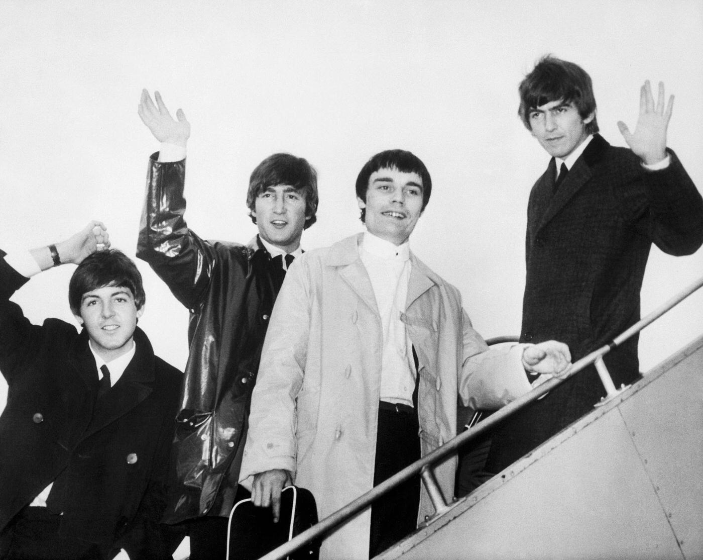 The Beatles Minus Ringo Starr Departing For Netherlands And Denmark With Jimmy Nicol, 1964.