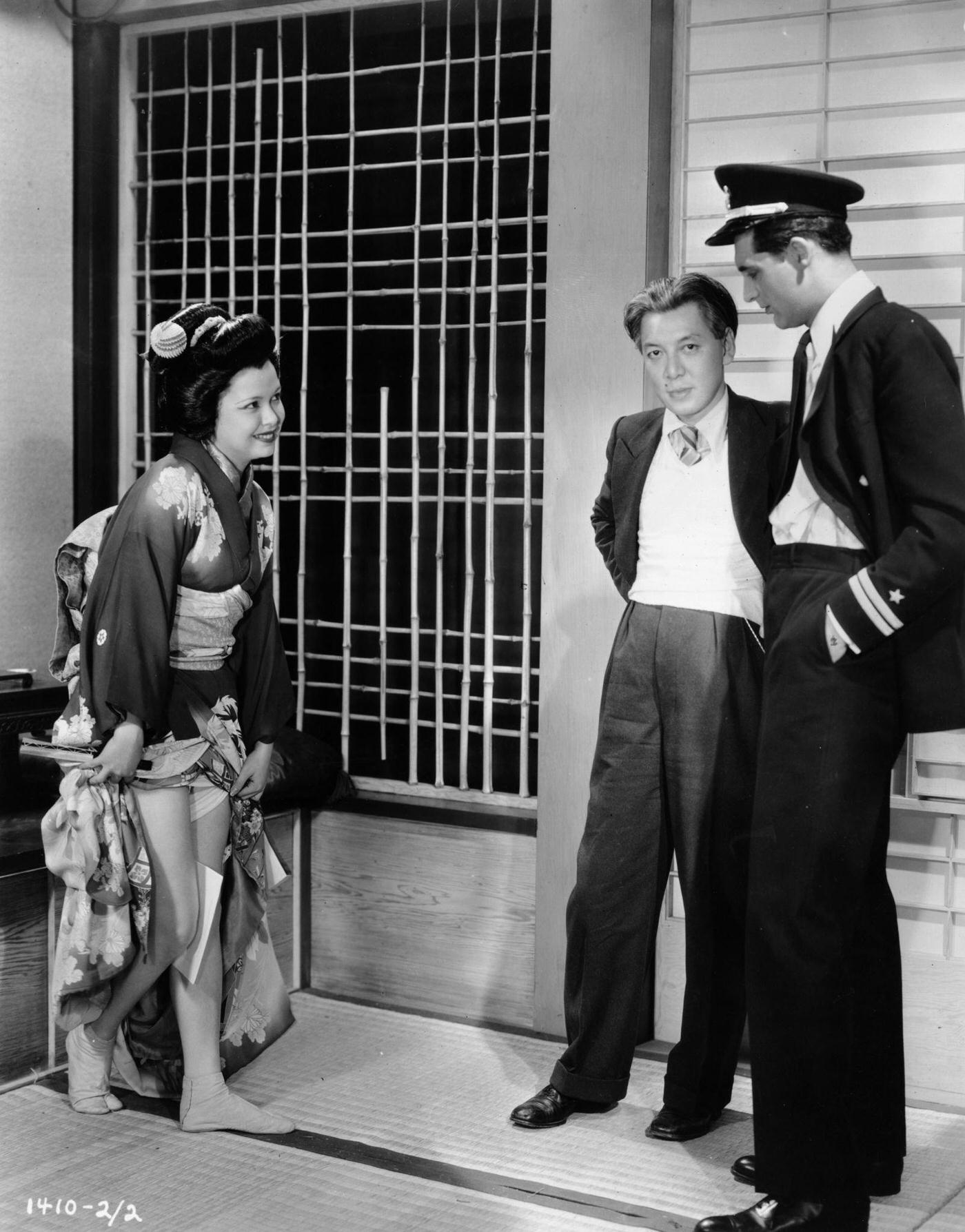 Cary Grant Watches As An Extra Learns To Walk Like A Japanese Geisha During The Filming Of 'Madame Butterfly,' 1932.