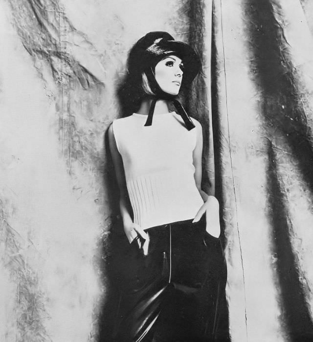 Nicole De La Marge In White Sweater And Rubber-Proofed Trousers, 1965
