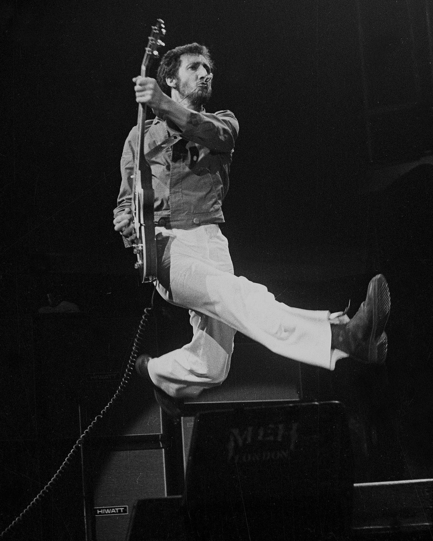 Pete Townshend Of The Who Leaps With His Electric Guitar During A Performance, Circa 1978.
